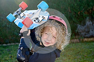 Little blond boy with skateboard