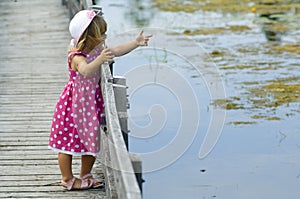 Little blond girl on boardwalk