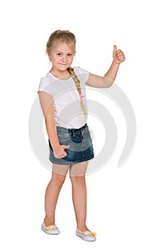 Little blond girl with her thumb up