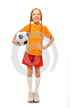 Little blond girl holding soccer ball isolated