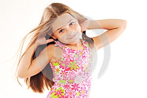 Little blond girl playing with her hair