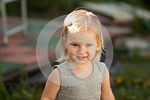 Little blond girl smiling