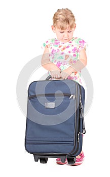 Little blond hair girl with suitcase