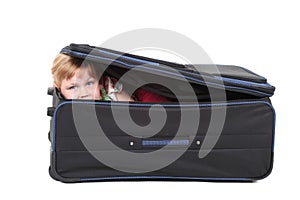 Little blond hair girl in suitcase