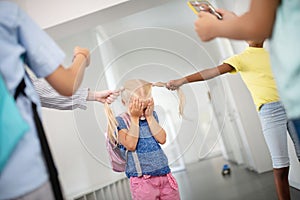 Little blonde girl closing face while feeling frustrated and lonely