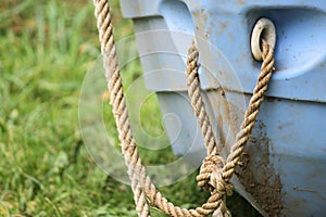 Little blue boat with rope