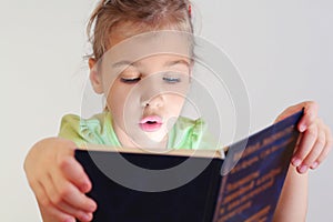 Little blue eyes girl read blue book