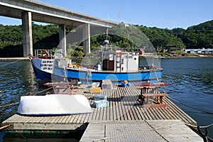 Little Blue Fisherman Boat connected with Gangway