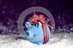 Little blue piggy with a red bow