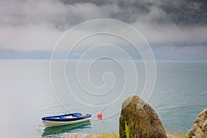 Little boat on water surface