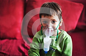 Little boy with aerosols inhaler