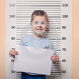 Little boy against police line-up