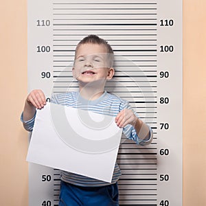 Little boy against police line-up