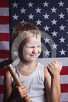 The little boy with the American flag in the background,