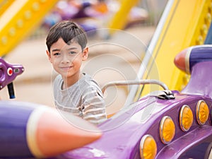 Little boy in an amusement park