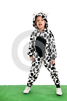 Little boy as happy cow in the meadows