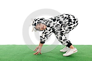 Little boy as happy cow in the meadows