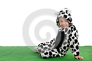 Little boy as happy cow in the meadows