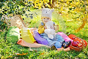 Little boy  in  autumnal forest