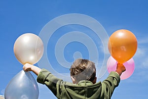 little boy with balloons