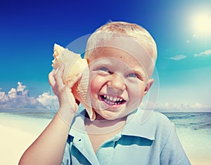 Little Boy Beach Seashell Fun Vacation Concept