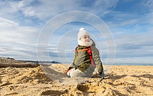 Little boy on beach, winter season