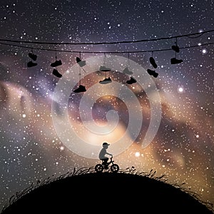 Little boy on bicycle at night