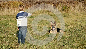 Little boy and big dog (German Shepherd )