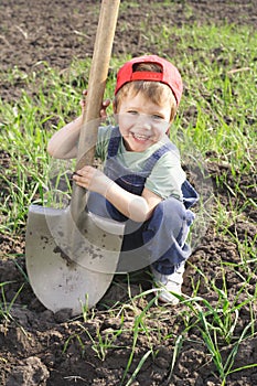 Little boy with big shovel