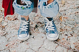 Little Boy in Blue Sneakers