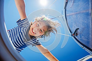 Little boy on board of sailing yacht on summer cruise. Travel adventure, yachting with child on family vacation.