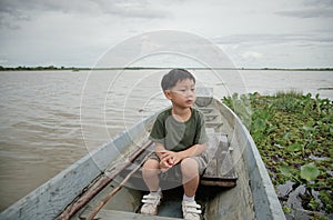 Little boy on a boat ride at Lake