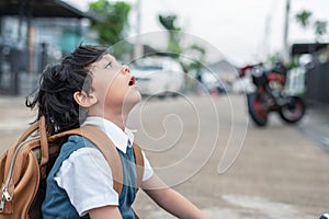 Little boy boring to go to school in morning. Kids students having boredom in depress emotion. People and Lifestyles concept.