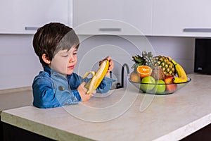 Little boy with a bowl of fresh fruits