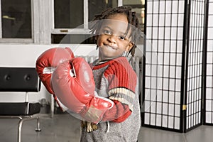 Little boy in boxing gloves