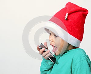 Little boy calling Santa Claus