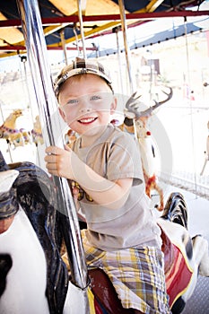 Little Boy on a Carnival Carousel