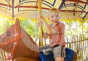 Little Boy on a Carnival Carousel