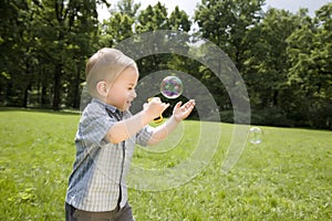 Little Boy Catch Soap Bubbles