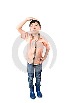 Little boy checkin his height growth on white background photo