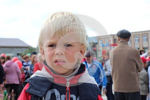 The little boy child of five years he withdrew from people offended gloomy portrait