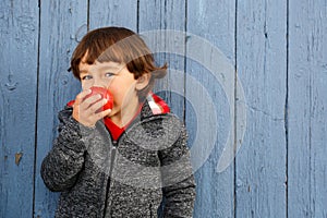 Little boy child kid eating apple fruit smiling healthy