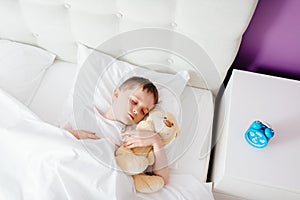 Little boy child sleeping in bed