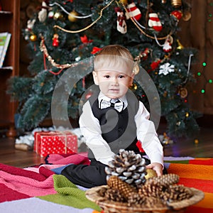 Little boy in Christmas decorations