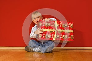 Little boy with christmas gifts