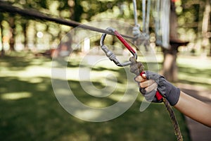 Little boy climbs in rope park, climber
