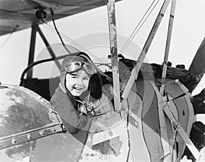 Little boy in cockpit of plane