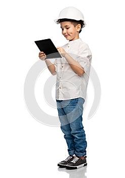 little boy in construction helmet with tablet pc