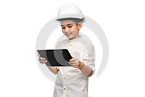 little boy in construction helmet with tablet pc