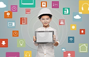 little boy in construction helmet with tablet pc
